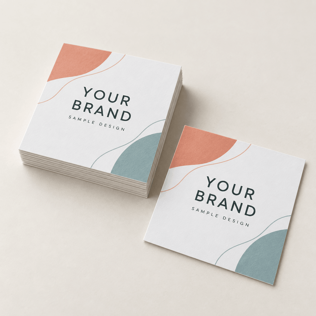 Sample 3 × 3 inch square business cards with coral and teal artwork on white cover stock.
